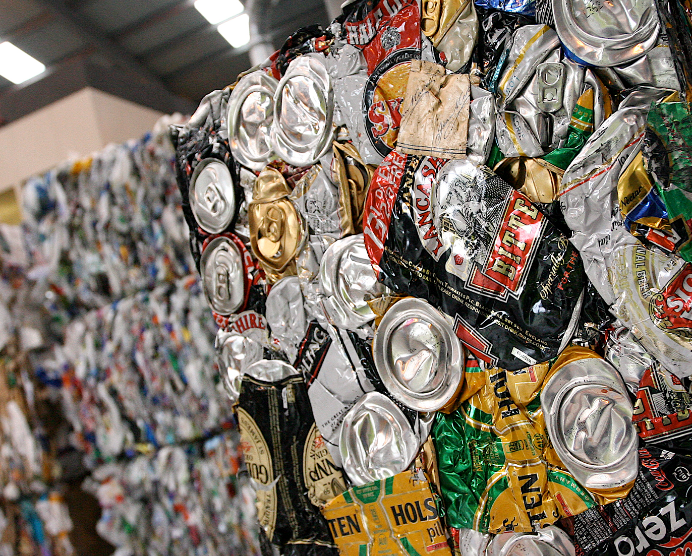Stacks of crushed cans in a recycling facility