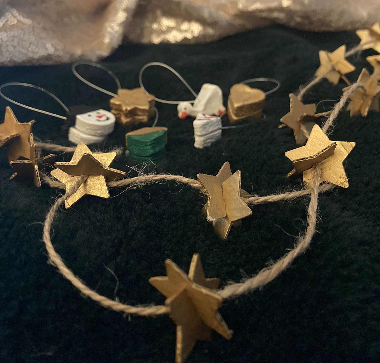 Using brown string gives your cardboard star garland a more rustic aesthetic, but jewellery wire can be used if you prefer a cleaner look.
